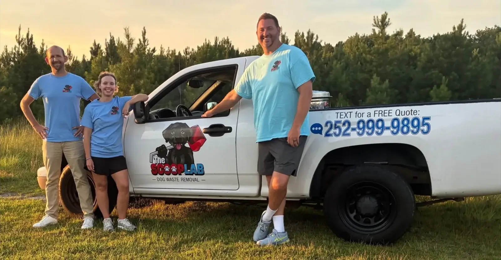 The Scoop Lab team beside their branded dog waste removal truck in Pitt County, North Carolina